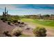 Elevated view of a golf course with desert landscaping at 2549 W Shinnecock Way, Anthem, AZ 85086