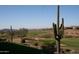 Golf course with saguaro cacti and mountain views at 2549 W Shinnecock Way, Anthem, AZ 85086