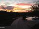 Stunning sunset over mountain range from pool area at 2549 W Shinnecock Way, Anthem, AZ 85086