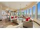 Open concept living room and kitchen with stunning views, featuring comfortable seating and a large island at 2549 W Shinnecock Way, Anthem, AZ 85086