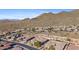 Community overview, showcasing desert landscape, homes, and golf course at 2549 W Shinnecock Way, Anthem, AZ 85086