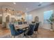 Bright dining room with a large table and six chairs at 13050 W Running Deer Trl, Peoria, AZ 85383