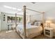 Main bedroom with a large canopy bed and window seat at 4632 E Desert Park Pl, Paradise Valley, AZ 85253