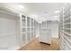 Bright walk-in closet with custom shelving and drawers at 4632 E Desert Park Pl, Paradise Valley, AZ 85253