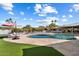 Inviting kidney-shaped pool surrounded by flagstone and lush lawn at 4632 E Desert Park Pl, Paradise Valley, AZ 85253