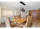 Elegant dining room with a large wooden table and modern chandelier at 4632 E Desert Park Pl, Paradise Valley, AZ 85253