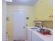 Bright laundry room with washer, dryer, and cabinets at 624 Leisure World --, Mesa, AZ 85206