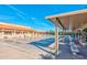 Outdoor shuffleboard courts situated under a shaded pergola at 624 Leisure World --, Mesa, AZ 85206