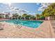 Community pool with ample seating and umbrellas at 624 Leisure World --, Mesa, AZ 85206