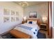 Cozy guest bedroom with a comfortable bed and stylish decor at 1427 E Cherrywood Pl, Chandler, AZ 85249