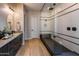 Modern bathroom with a large walk-in shower and dark vanity at 1417 E Cherrywood Pl, Chandler, AZ 85249