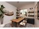 Bright home office with a large wood desk and built-in shelving at 1417 E Cherrywood Pl, Chandler, AZ 85249