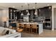 Modern kitchen with dark cabinetry, an island, and stainless steel appliances at 1417 E Cherrywood Pl, Chandler, AZ 85249