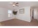 Bright living room with neutral carpeting and ceiling fan at 2600 E Allred Ave # R82, Mesa, AZ 85204