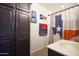 Bathroom with Texas-themed decor and linen closet at 7503 W Julie Dr, Glendale, AZ 85308