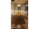 Bright dining room with wood floors, light wood table and chairs, and a woven pendant light at 1320 E Coolidge St, Phoenix, AZ 85014