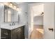 Modern bathroom with dark vanity and white countertop at 13318 W Stonebrook Dr, Sun City West, AZ 85375