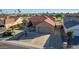 Single-story home with a two-car garage and desert landscaping at 14113 W Via Montoya Dr, Sun City West, AZ 85375