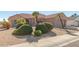 Tan house with tile roof and nicely landscaped yard at 14113 W Via Montoya Dr, Sun City West, AZ 85375