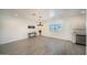 Modern dining area with wood-look floors and kitchen access at 1918 N 22Nd Pl, Phoenix, AZ 85006