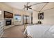 Main bedroom with fireplace, large windows, and a four poster bed at 19915 E Sonoqui Blvd, Queen Creek, AZ 85142