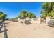 Long driveway leading through the farm with fencing and landscaping at 19915 E Sonoqui Blvd, Queen Creek, AZ 85142