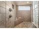 Spacious walk-in shower with tiled walls and built-in seat at 19915 E Sonoqui Blvd, Queen Creek, AZ 85142