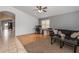 Living room with hardwood floors, a couch and a workspace at 7832 E Osage Ave, Mesa, AZ 85212