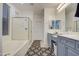 Large bathroom with double sinks, a bathtub, and shower at 218 E Sunburst Ln, Tempe, AZ 85284
