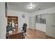 Home office features built-in shelving and a desk with chair at 218 E Sunburst Ln, Tempe, AZ 85284