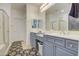 Bathroom with double vanity, shower, and separate tub at 218 E Sunburst Ln, Tempe, AZ 85284