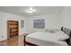 Spacious bedroom with wood floors and a dresser at 218 E Sunburst Ln, Tempe, AZ 85284