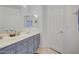 Double vanity bathroom with grey cabinets and a large mirror at 218 E Sunburst Ln, Tempe, AZ 85284