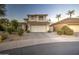 Two-story house with attached garage and desert landscaping at 218 E Sunburst Ln, Tempe, AZ 85284