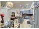 Kitchen with island, blue cabinets, and granite countertops at 218 E Sunburst Ln, Tempe, AZ 85284