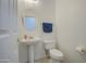 Powder room with pedestal sink and toilet at 218 E Sunburst Ln, Tempe, AZ 85284