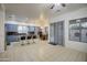 Kitchen features island with seating, stainless steel appliances, and blue cabinets at 218 E Sunburst Ln, Tempe, AZ 85284