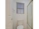 Clean bathroom with a shower/tub, toilet, and window at 218 E Sunburst Ln, Tempe, AZ 85284