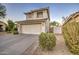 Two-story house with attached garage and desert landscaping at 218 E Sunburst Ln, Tempe, AZ 85284