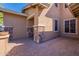 Brick paved patio with stone pillars and a large planter at 12473 W Montgomery Rd, Peoria, AZ 85383