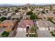 Aerial view of a house with solar panels and a large backyard in a residential neighborhood at 6440 E Odessa St, Mesa, AZ 85215