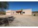 Ranch style home with desert landscaping, attached garage, and a large front yard at 42211 N Spur Cross Rd, Cave Creek, AZ 85331