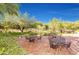 Inviting patio with wrought iron furniture, perfect for outdoor dining at 3318 N Brighton --, Mesa, AZ 85207