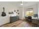 Cozy bedroom featuring a home office and hardwood floors at 3318 N Brighton --, Mesa, AZ 85207