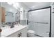 Updated bathroom with a walk-in shower, tile surround, and modern vanity at 9302 E Broadway Rd # 9, Mesa, AZ 85208