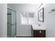 Clean bathroom with a walk-in shower, vanity, and vinyl flooring at 9302 E Broadway Rd # 9, Mesa, AZ 85208