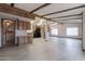 Open kitchen with wood cabinets, modern appliances, and vinyl flooring at 9302 E Broadway Rd # 9, Mesa, AZ 85208