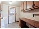 Laundry room with washer, dryer, and built-in wooden counter space at 9302 E Broadway Rd # 9, Mesa, AZ 85208