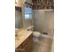 Bathroom with shower, toilet, and vanity at 20407 N 107Th Dr, Sun City, AZ 85373