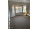 Bright bedroom with bay window and carpet at 20407 N 107Th Dr, Sun City, AZ 85373